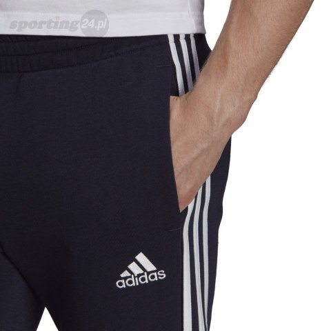 Spodnie męskie adidas Essentials Tapered Cuff 3 Stripes granatowe GK8977 Adidas Spodnie męskie adidas Essentials Tapered Cuff 3 Stripes granatowe GK8977 Adidas