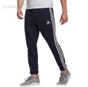 Spodnie męskie adidas Essentials Tapered Elastic Cuff 3 Stripes Pant granatowe GK8830 Adidas