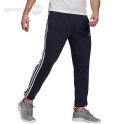 Spodnie męskie adidas Essentials Tapered Elastic Cuff 3 Stripes Pant granatowe GK8830 Adidas