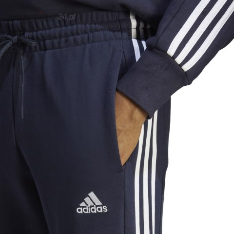 Spodnie męskie adidas Essentials French Terry Tapered Cuff 3-Stripes granatowe IC9406 Adidas Spodnie męskie adidas Essentials French Terry Tapered Cuff 3-Stripes granatowe IC9406 Adidas