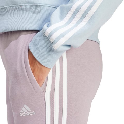 Spodnie damskie adidas Essentials 3-Stripes Fleece fioletowe IR5403 Adidas Spodnie damskie adidas Essentials 3-Stripes Fleece fioletowe IR5403 Adidas