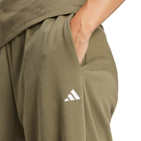 Spodnie damskie adidas Essentials Small Logo French Terry Cuffed zielone JD9927 Adidas Spodnie damskie adidas Essentials Small Logo French Terry Cuffed zielone JD9927 Adidas